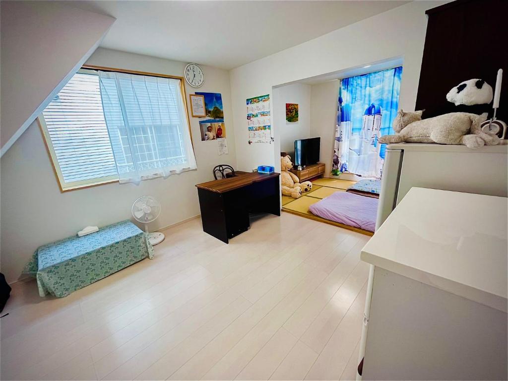 TV a/nebo společenská místnost v ubytování Aibi House