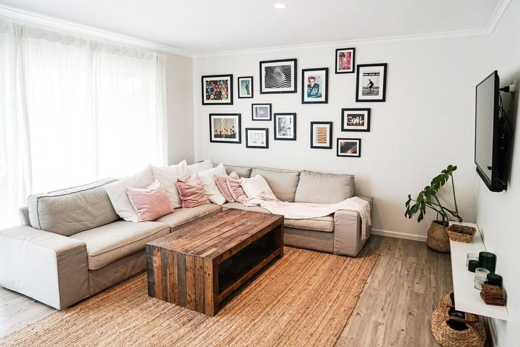 a living room with a couch and a coffee table at Central 3 Bdr House - Walk to town & pub in Bangalow