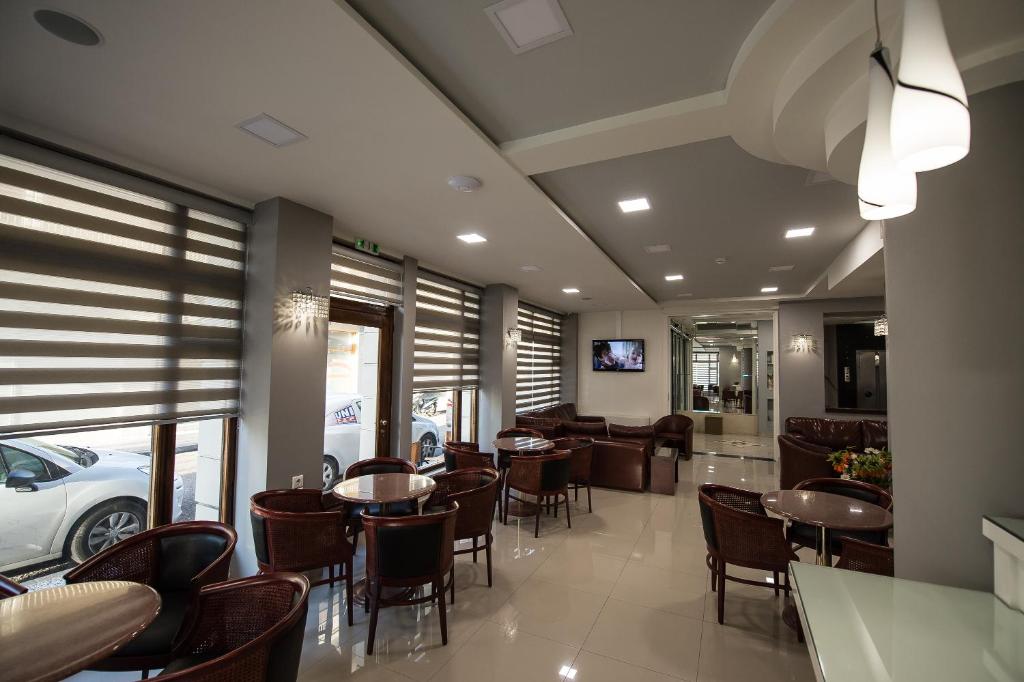 TV a/nebo společenská místnost v ubytování Hotel Olympos