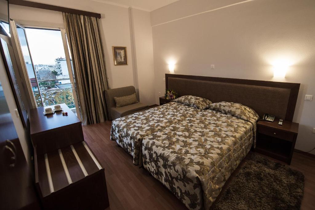 Postel nebo postele na pokoji v ubytování Hotel Olympos