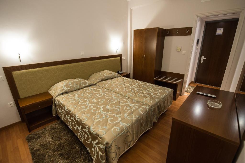 Postel nebo postele na pokoji v ubytování Hotel Olympos