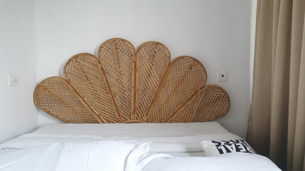 Postel nebo postele na pokoji v ubytování Kadal The Beach House