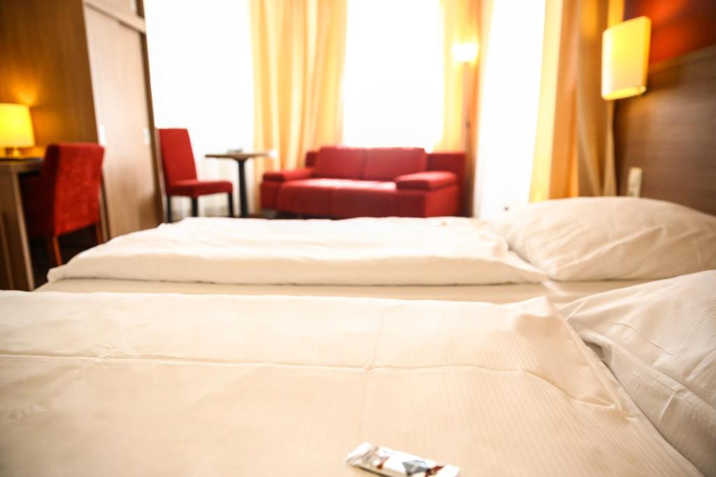 Postel nebo postele na pokoji v ubytování Hotel Marienthal Garni