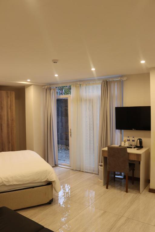 Телевизор и/или развлекательный центр в Yankı Hotel