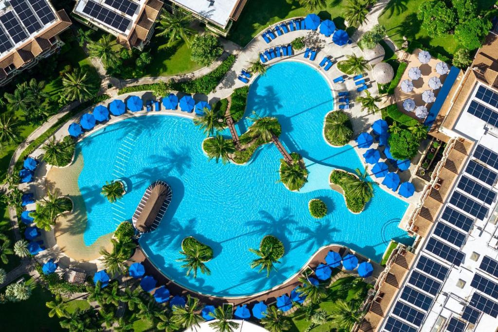 an overhead view of a swimming pool at a resort at Phuket Marriott Resort & Spa, Merlin Beach in Patong Beach