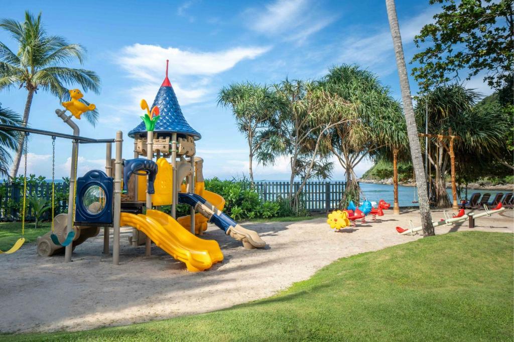 a playground with a castle and a slide at Phuket Marriott Resort & Spa, Merlin Beach in Patong Beach