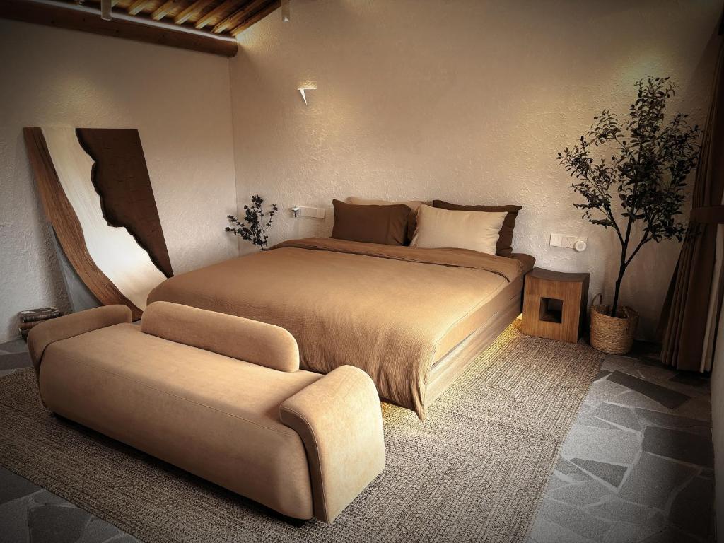 Postel nebo postele na pokoji v ubytování Resort in the valley of Zen 無名川禅意概念酒店