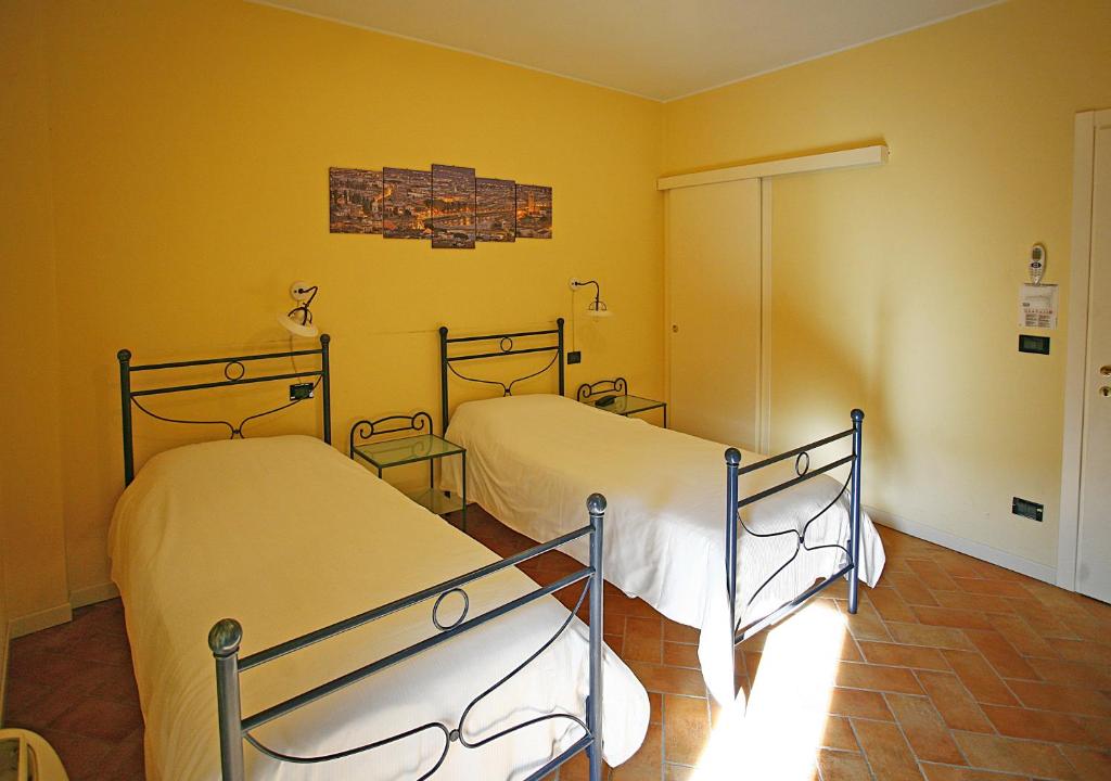 Postel nebo postele na pokoji v ubytování Hotel Antichi Cortili
