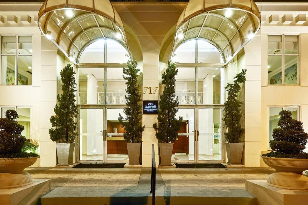 a lobby of a building with potted plants at Marriott Executive Apartments Sao Paulo in Sao Paulo