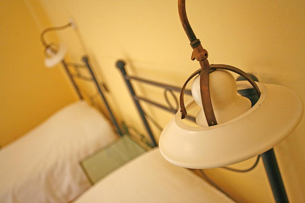 Postel nebo postele na pokoji v ubytování Hotel Antichi Cortili
