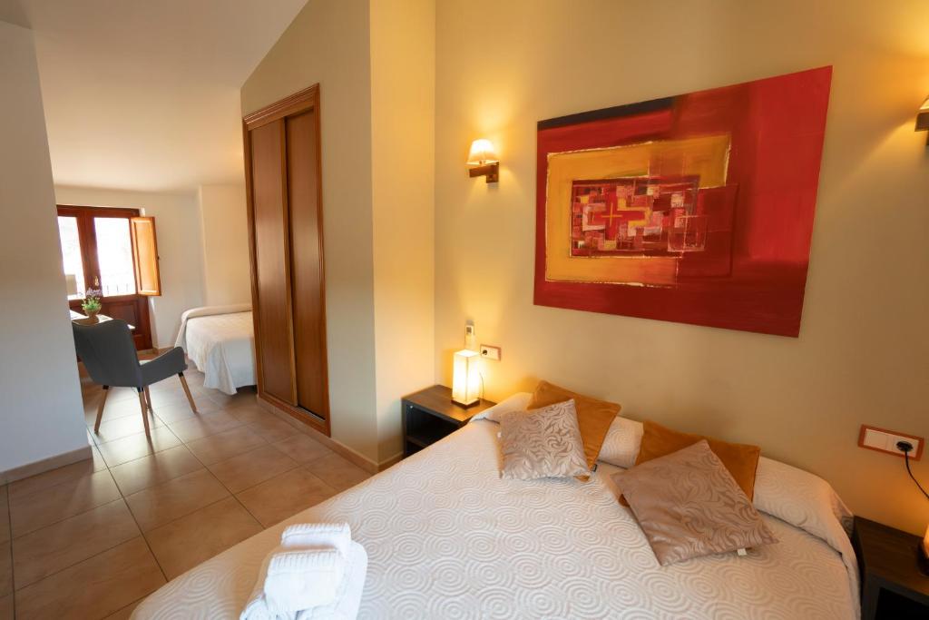 Postel nebo postele na pokoji v ubytování Hotel Rural L'Antic Portal