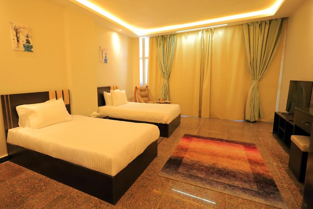Postel nebo postele na pokoji v ubytování Blue Lotus Nile Suites Hotel Aswan