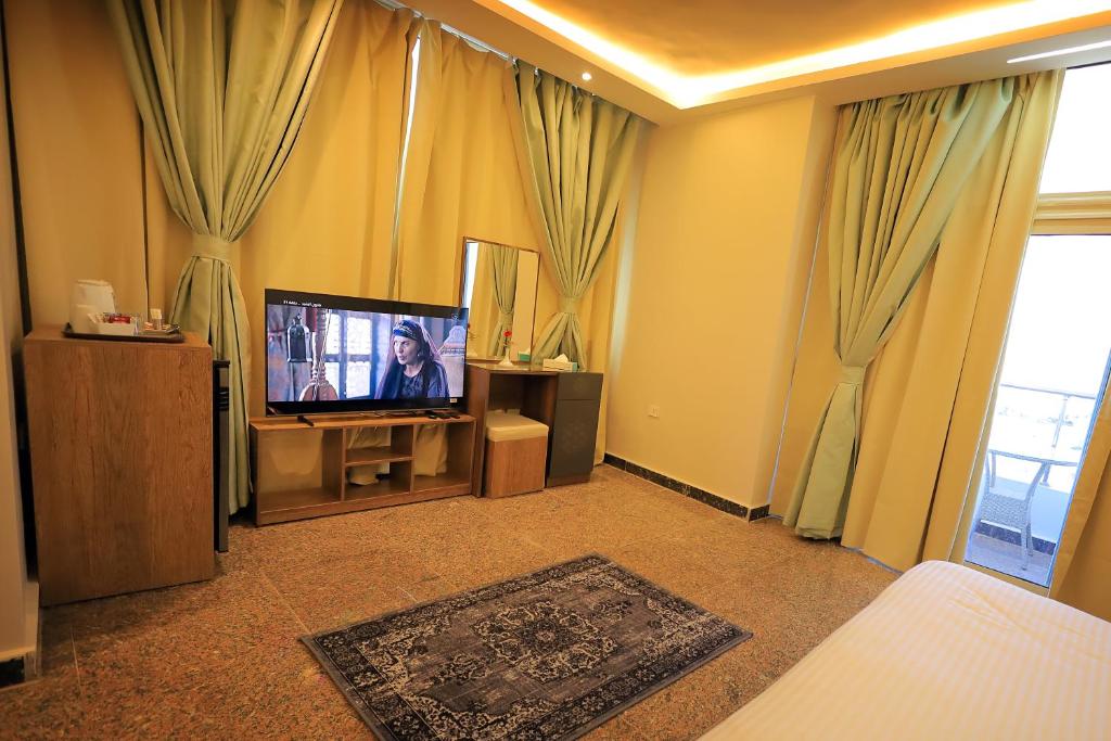 TV a/nebo společenská místnost v ubytování Blue Lotus Nile Suites Hotel Aswan