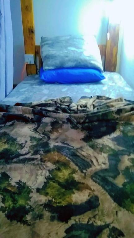 Postel nebo postele na pokoji v ubytování Ella Kumi Hostel