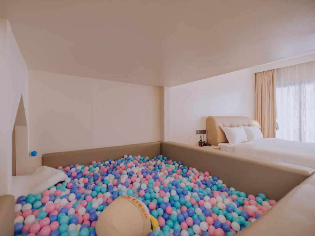 Postel nebo postele na pokoji v ubytování YUSU Hotel 羽宿酒店
