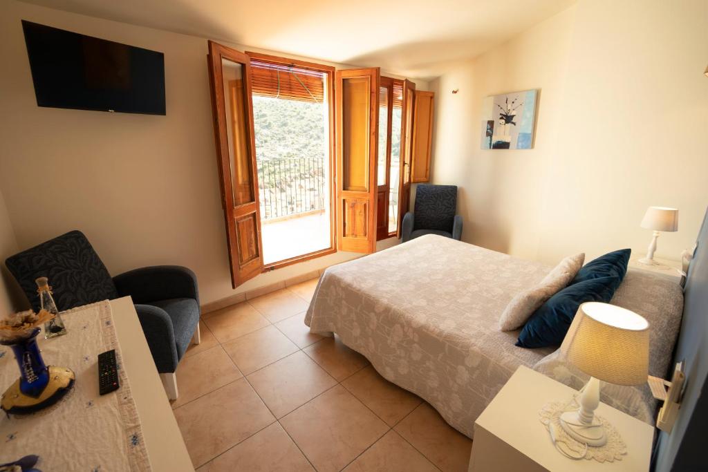 Postel nebo postele na pokoji v ubytování Hotel Rural L'Antic Portal