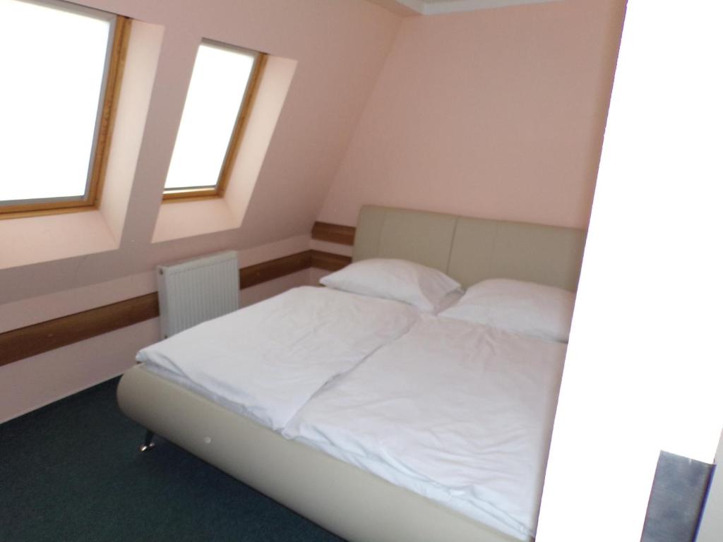 Postel nebo postele na pokoji v ubytování Motel Oseček