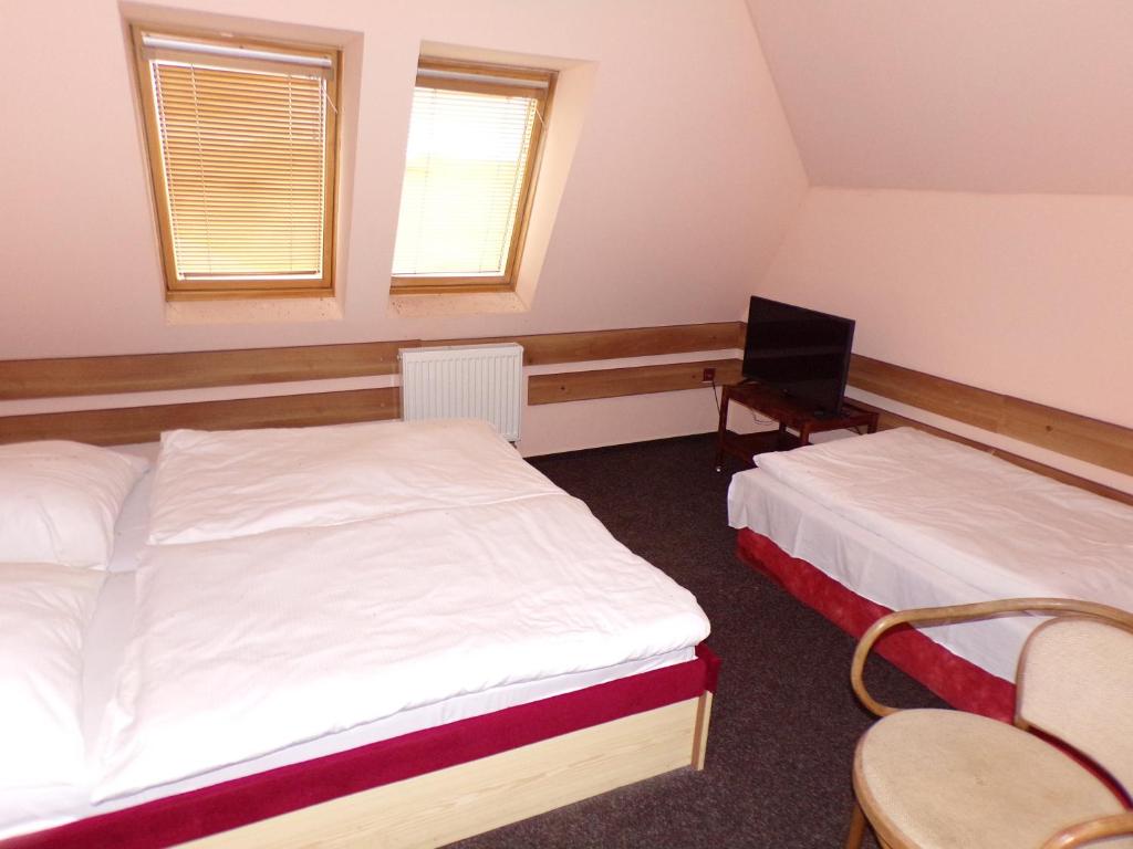 Postel nebo postele na pokoji v ubytování Motel Oseček