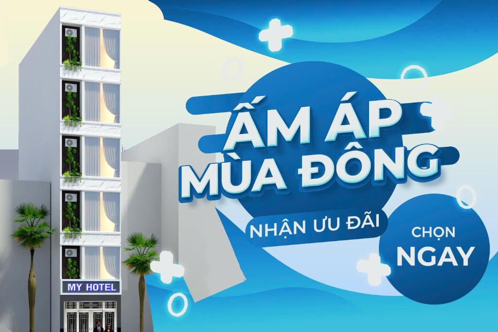 uma faixa para a Imap Mua em frente a um prédio em My Hotel Quy Nhơn em Quy Nhon