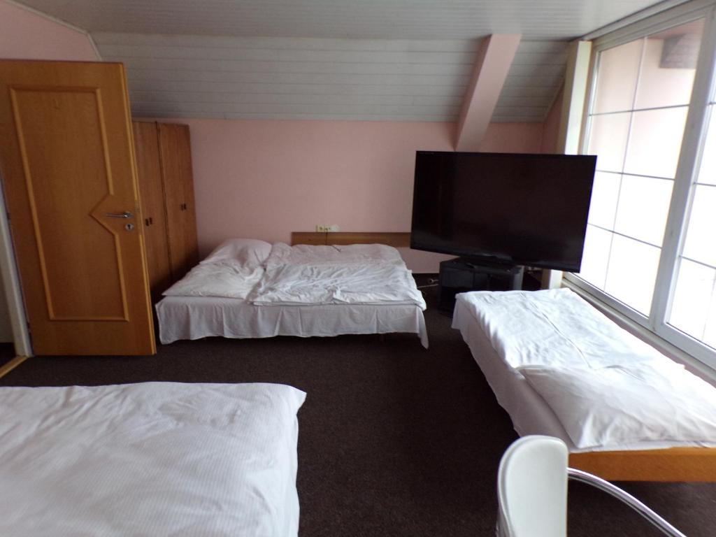 Postel nebo postele na pokoji v ubytování Motel Oseček