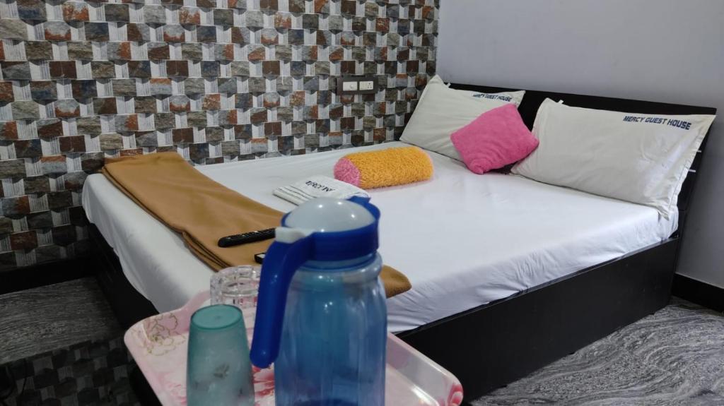 Postel nebo postele na pokoji v ubytování MERCY INN
