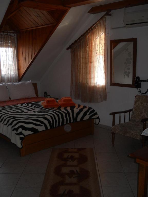 A bed or beds in a room at Guesthouse Agnandi