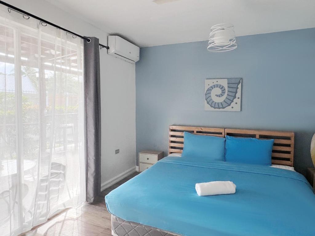 Postel nebo postele na pokoji v ubytování Kalachuchi Inn 薄荷雞蛋花旅宿