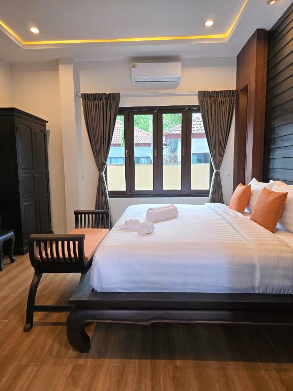 Postel nebo postele na pokoji v ubytování Blue Palm Residence Kata