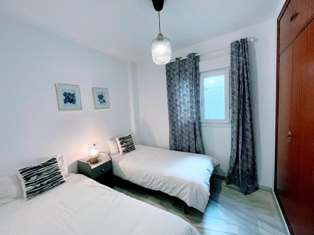 Posteľ alebo postele v izbe v ubytovaní Central Apartment in Sanlucar