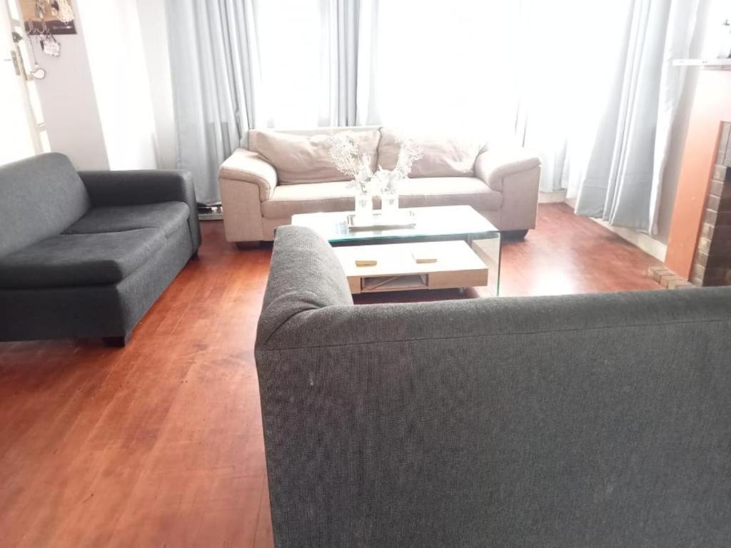 a living room with two couches and a coffee table at 60 ON Kennington in East London