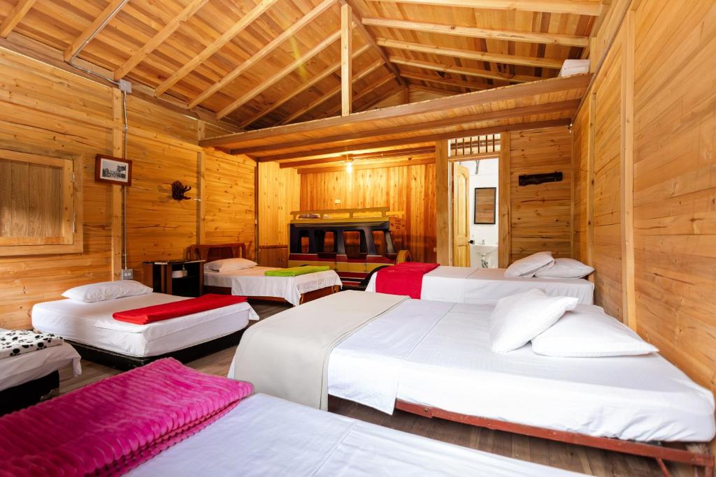 Postel nebo postele na pokoji v ubytování Hotel Orillas del Pizano