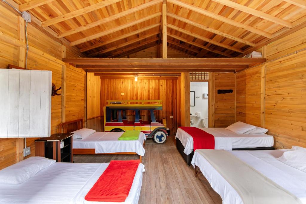 Postel nebo postele na pokoji v ubytování Hotel Orillas del Pizano