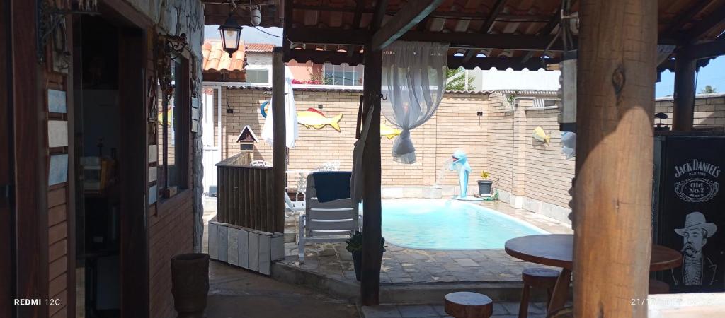 a view of a swimming pool from a building at Rancho Chalé Vila Gostoso in Touros