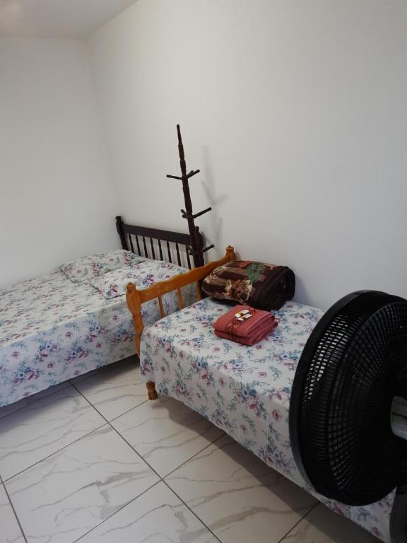 Postel nebo postele na pokoji v ubytování Hotel Pousada Guaratuba