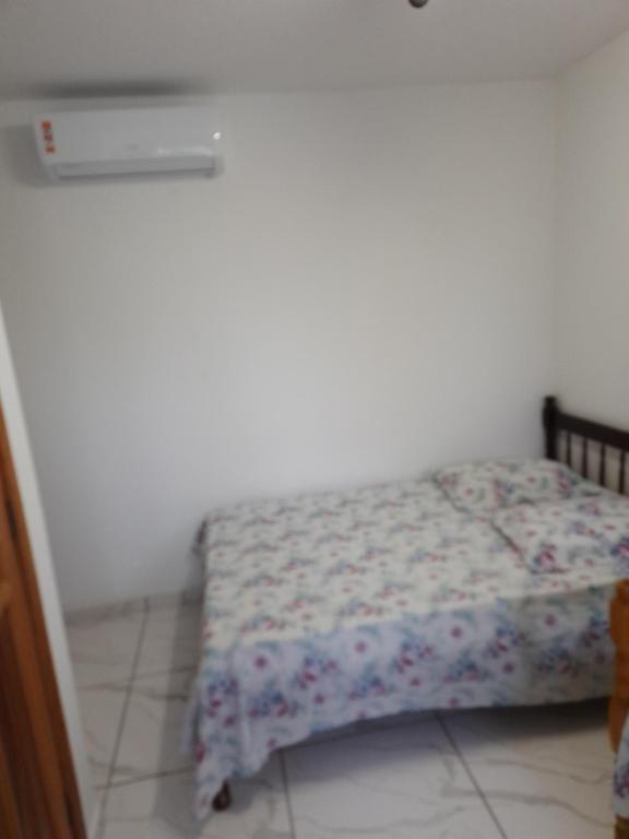 Postel nebo postele na pokoji v ubytování Hotel Pousada Guaratuba