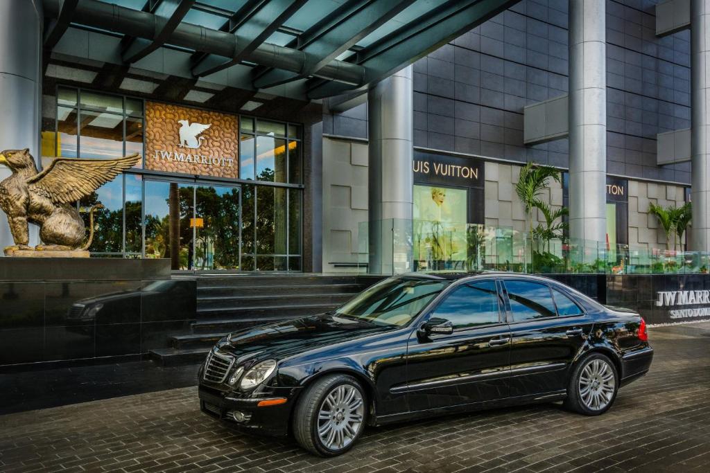 a black car parked in front of a building at JW Marriott Hotel Santo Domingo in Santo Domingo
