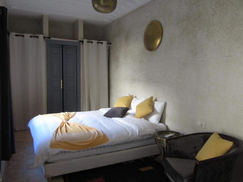 Postel nebo postele na pokoji v ubytování Riad La Porte de l'oasis