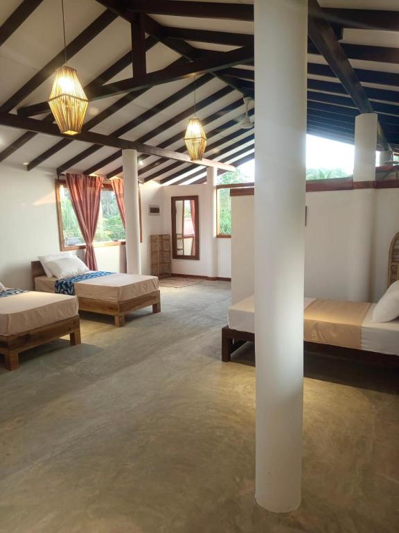 Postel nebo postele na pokoji v ubytování Sri Lanka Surf Villa Domus Graziella