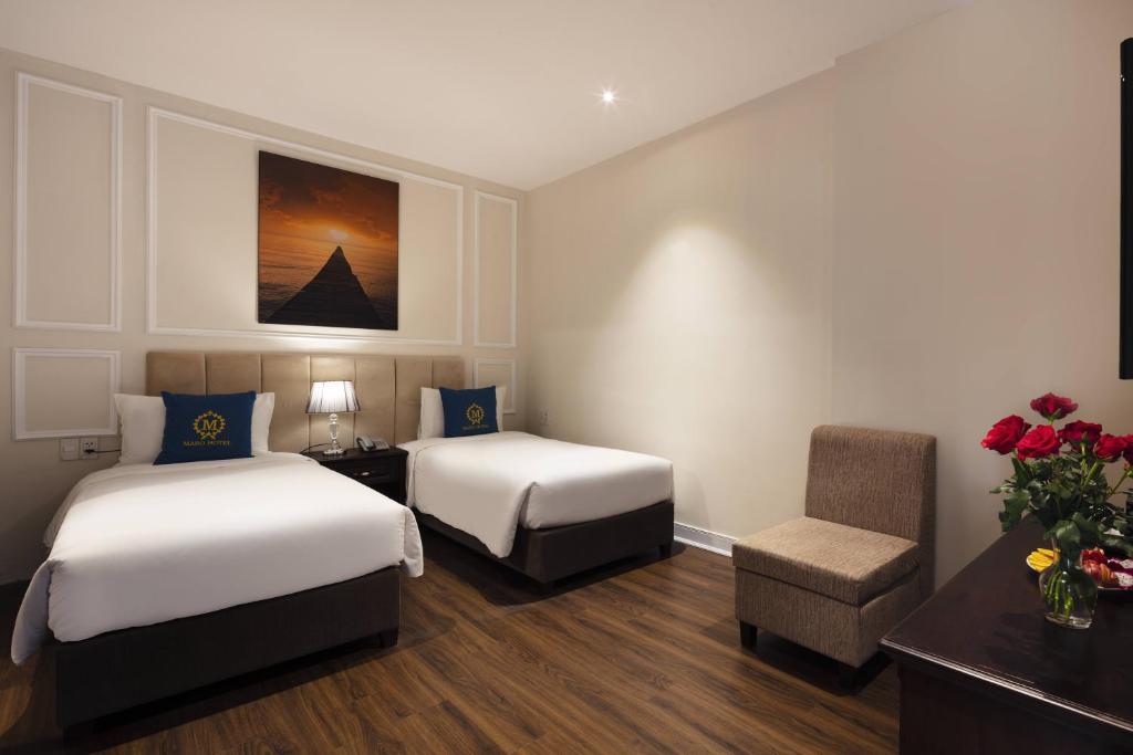 Postel nebo postele na pokoji v ubytování Maro Hotel & Apartment