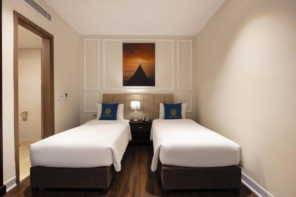 Postel nebo postele na pokoji v ubytování Maro Hotel & Apartment
