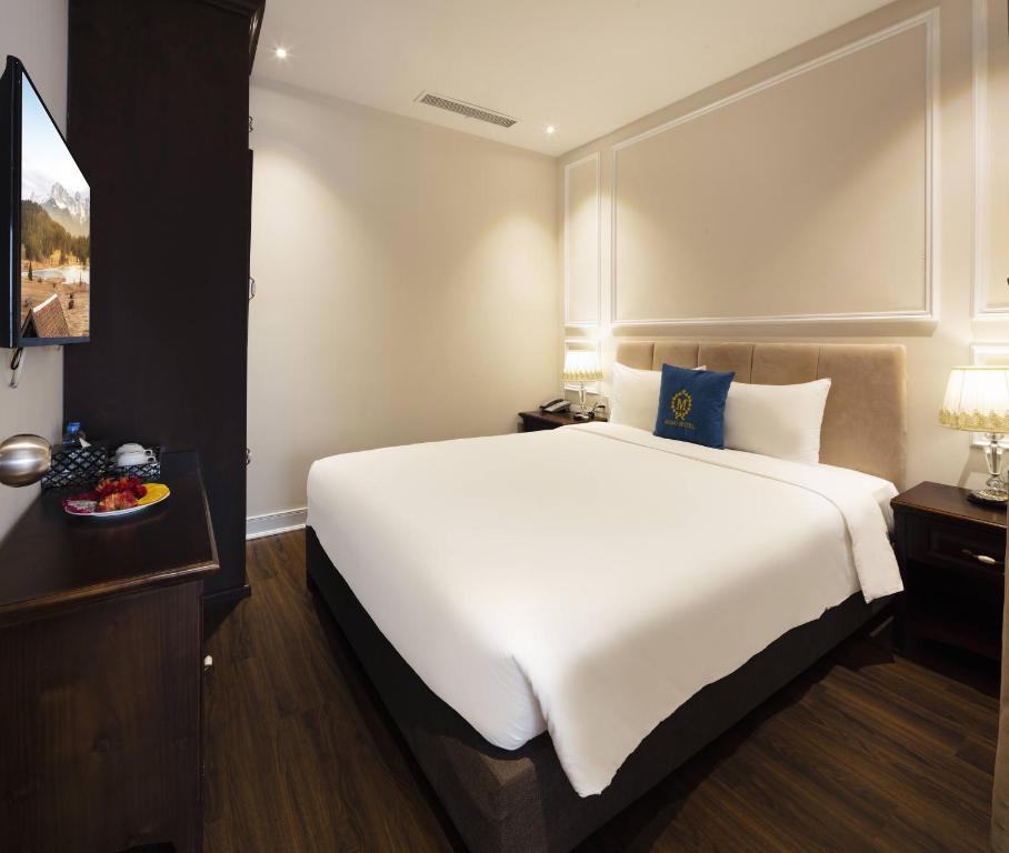 Postel nebo postele na pokoji v ubytování Maro Hotel & Apartment