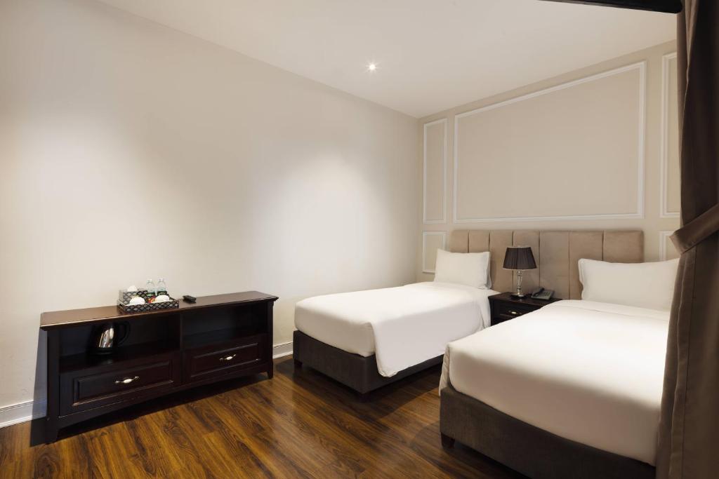 Postel nebo postele na pokoji v ubytování Maro Hotel & Apartment