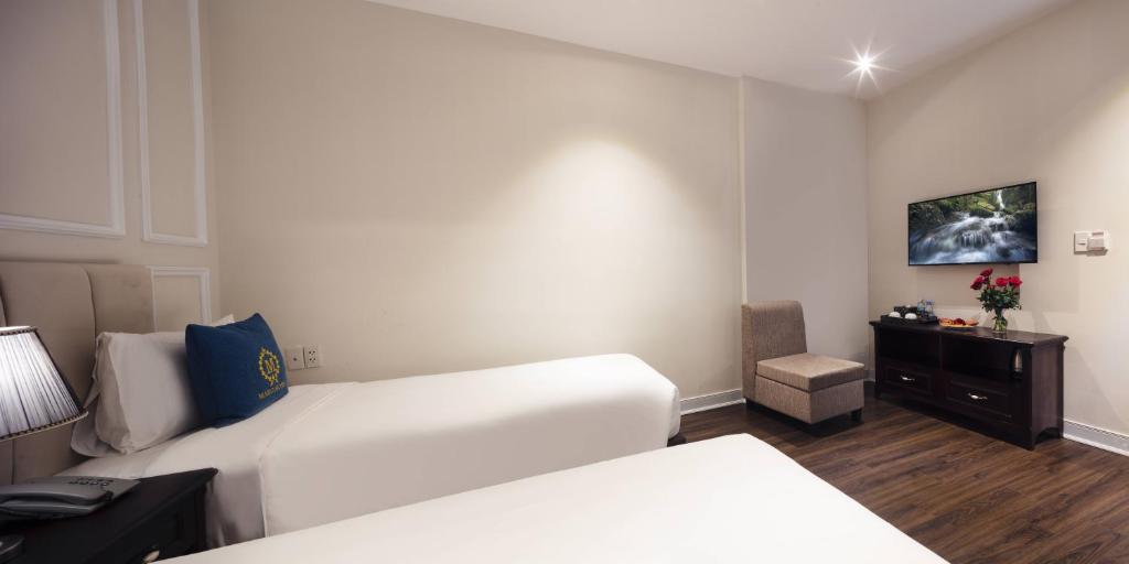 Postel nebo postele na pokoji v ubytování Maro Hotel & Apartment