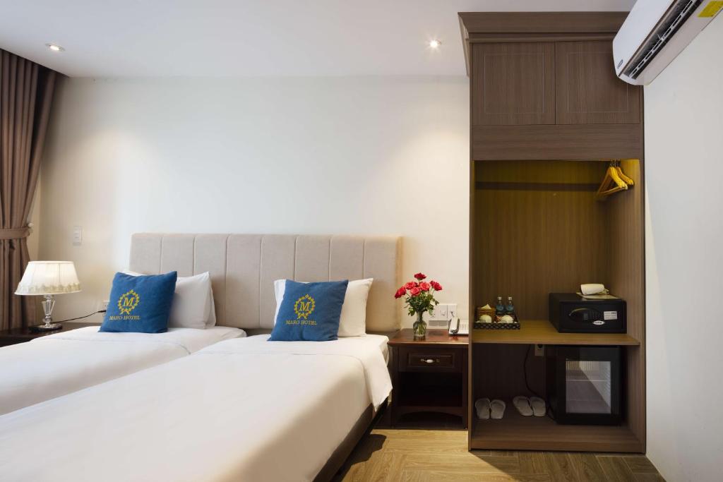 Postel nebo postele na pokoji v ubytování Maro Hotel & Apartment