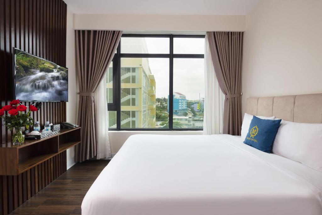 Postel nebo postele na pokoji v ubytování Maro Hotel & Apartment