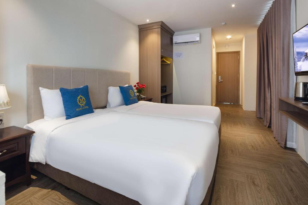 Postel nebo postele na pokoji v ubytování Maro Hotel & Apartment