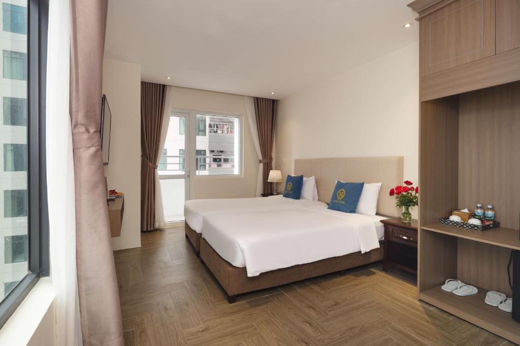 Postel nebo postele na pokoji v ubytování Maro Hotel & Apartment