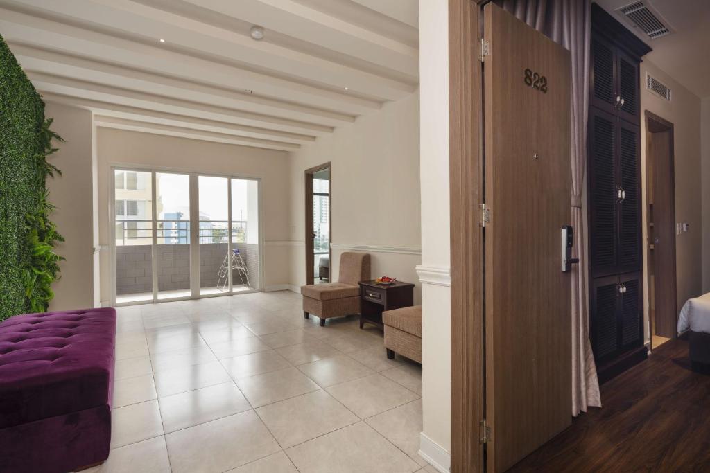 Postel nebo postele na pokoji v ubytování Maro Hotel & Apartment