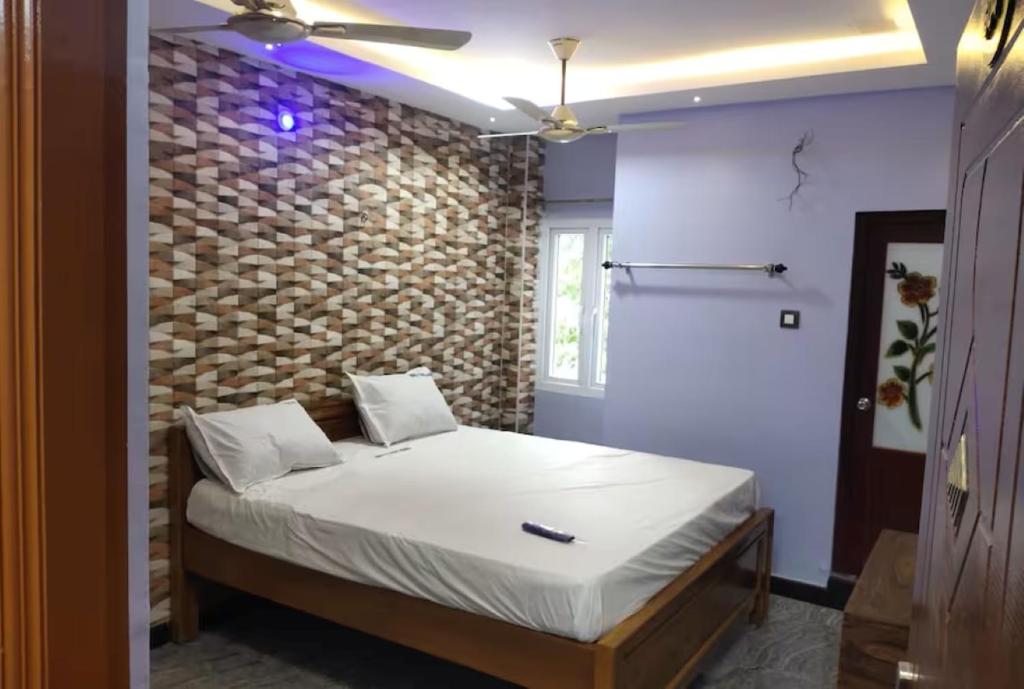 Postel nebo postele na pokoji v ubytování MERCY INN