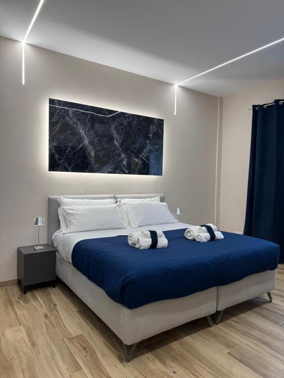 Postel nebo postele na pokoji v ubytování Raffaelli Suite